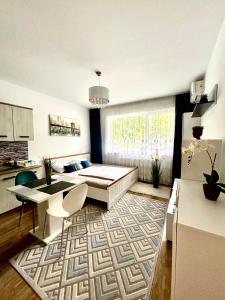 a living room with a couch and a table at Kiki home in Oradea