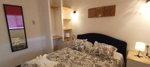 a bedroom with a bed with pillows on it at Villa Golden Coast - Lagos in Lagos