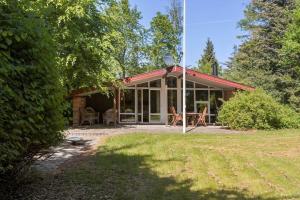 a house with a screened in porch and a yard at LF15191-Hojslev-Ternevej-31 in Højslev