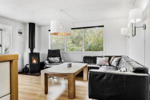 a living room with a couch and a table at LF160-Vestervig-Gunhildsvej-60 in Vestervig