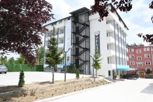 an apartment building with a black and white facade at Zelif Otel Havza in Havza