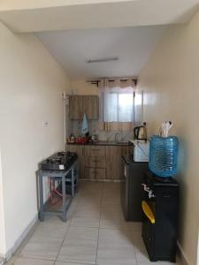 a kitchen with a counter and a table in it at Majestic studio in Rungiri