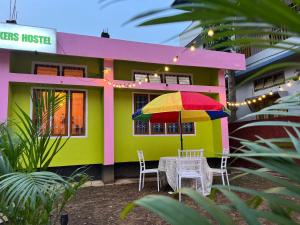 a house with a table and a colorful house at The Backpackers Hostel in Guwahati