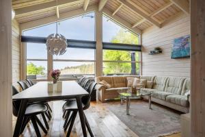 a living room with a couch and a table at LF15023-Skals-Lynderup-Strand-2 in Skals