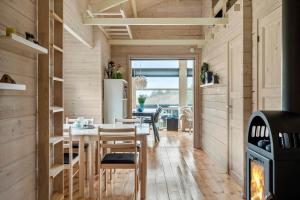 a kitchen and dining room with a table and a stove at LF15023-Skals-Lynderup-Strand-2 in Skals +20 photos