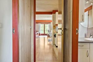 a hallway leading to a kitchen with an open door at LF18110-Veslos-Agerovej-13 in Vesløs +16 photos