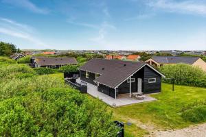 an aerial view of a house with a yard at 393-Harboore-Fourmivej-10 in Harboør