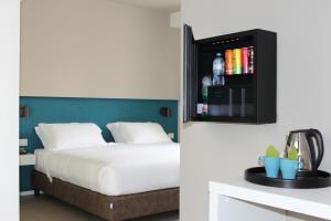 Postel nebo postele na pokoji v ubytování Airone City Hotel