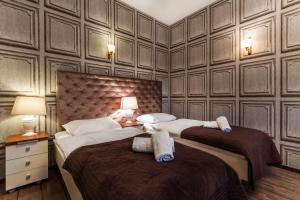 Posteľ alebo postele v izbe v ubytovaní Aparthotel Oberża
