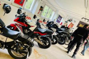 a group of motorcycles parked in a garage at Rockin 70's Lodges in Barbey-Séroux +122 photos