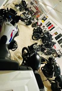 a bunch of motorcycles parked in a room at Rockin 70's Lodges in Barbey-Séroux