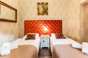 Posteľ alebo postele v izbe v ubytovaní Aparthotel Oberża