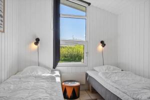 a bedroom with two beds and a window at LF159-Vestervig-Gunhildsvej-39 in Vestervig +28 photos