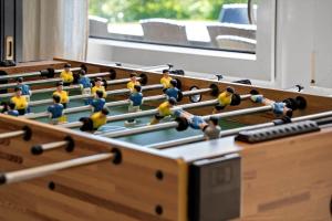 a group of toy people playing a game of pool at LF159-Vestervig-Gunhildsvej-39 in Vestervig