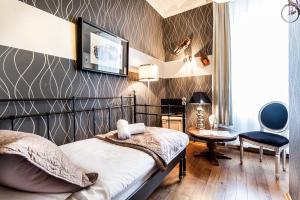 Posteľ alebo postele v izbe v ubytovaní Aparthotel Oberża