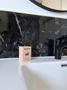 a box sitting on top of a counter next to a laptop at Chambres d'hôtes d'Isa in Bugeat +41 photos