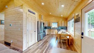 a kitchen and dining room of a tiny house at American Eagle Retreat in Conover