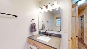 a bathroom with a sink and a mirror at American Eagle Retreat in Conover +19 photos