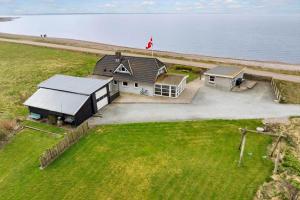 an aerial view of a house next to the water at LF332-Hurup-Helligsovej-32 in Hurup