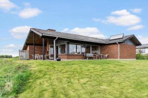 a brick house with a lawn in front of it at LF880-Snedsted-Over-Reese-11 in Snedsted +12 photos