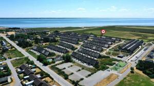 an aerial view of a city with houses and the ocean at 1160-Romo-Gulirisvej-160 in Høm