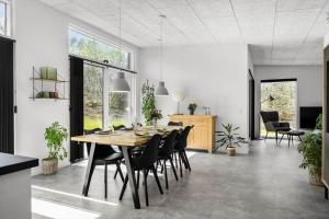a dining room with a table and chairs at LF302-Hurup-Helligsovej-2-F in Hurup