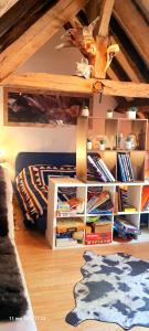 a room with a book shelf filled with books at La cazelle, dependance du 18 siecle, jacuzzi in Carsac-Aillac