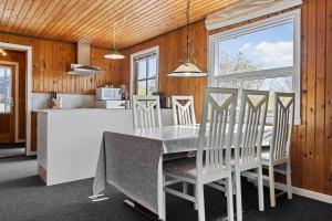 a kitchen and dining room with a table and chairs at LF14092-Roslev-Eskovvej-92 in Roslev +10 photos