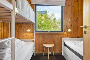 a bedroom with two bunk beds and a window at LF14092-Roslev-Eskovvej-92 in Roslev