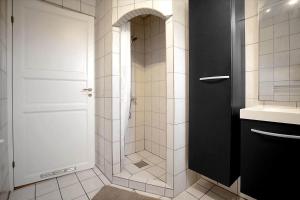 a bathroom with a shower with a glass door at 16655-Farevejle-Truntebakken-4 in Fårevejle +23 photos