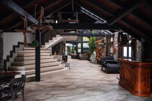 a living room with stairs and a stair case at Park hotel SVYAT in Skole