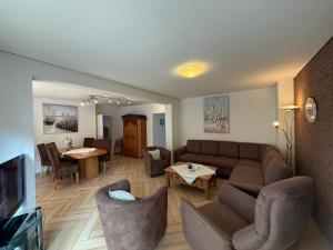 a living room with a couch and a table at Haus am Kurpark Wohnung 7 in Büsum