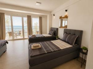 a living room with a bed and a couch at Villa Natali in Ohrid
