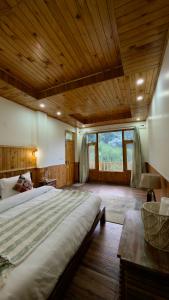 a large bedroom with a large bed in a building at Almost Home in Shangarh +23 photos