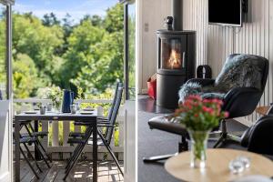 a living room with a table and a fireplace at LF16024-Farso-Kjeldhoj-24 in Farsø +11 photos