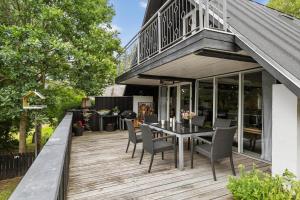 a patio with a table and chairs on a deck at LF15103-Farso-Rorsangervej-3 in Farsø