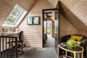 an attic office with a desk and a window at LF15103-Farso-Rorsangervej-3 in Farsø
