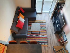 an overhead view of a living room with a couch and a table at Apartments Toni Two in Igrane
