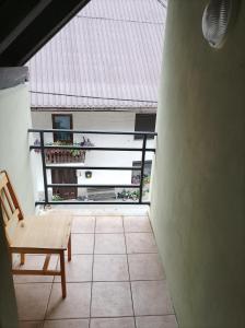 a room with a bench and a balcony with a roof at Soča Trails Apartment #6 in Log Čezsoški