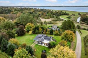 an aerial view of a house on a field with a road at LF15195-Hojslev-Sneppevej-25 in Højslev