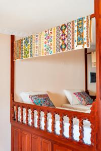 a bunk bed with two pillows on top of it at Maria's Studio 1 in Karpathos