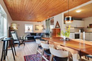 a kitchen and living room with a table and chairs at LF10313-Hurup-Thy-Fjordstraede-13 in Doverodde