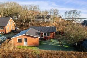 an aerial view of a house with a yard at LF10313-Hurup-Thy-Fjordstraede-13 in Doverodde