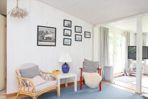 a living room with two chairs and a table at 13374-1-Vig-Thorsvej-4 in Vig