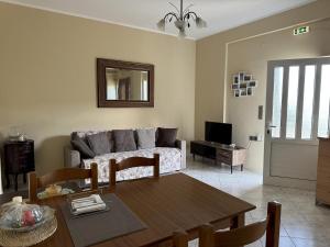 a living room with a couch and a table at Georgia in Gythio