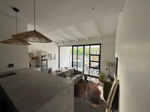 a living room with a couch and a table at RElaxed city living in Port Elizabeth
