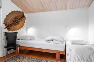 a room with a bed and a chair in it at LF14348-Roslev-Harrebjergvej-48 in Harre
