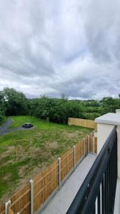 a view of a yard from the balcony of a house at Lidia House in Westport +1 photo