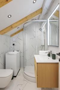 a bathroom with a shower and a toilet and a sink at Luxury room Sunset Cavtat in Cavtat