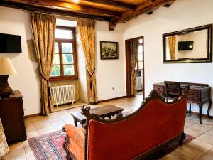 a living room with a couch and a table at Hotel Pazo Do Souto in Carballo